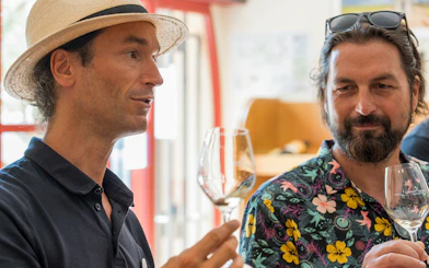 Men enjoying wine tasting on a morning tour in Cezanne countryside.