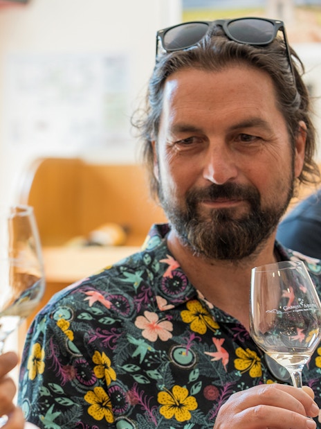 Men enjoying wine tasting on a morning tour in Cezanne countryside.