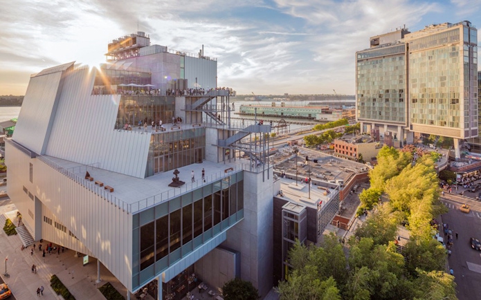 Whitney Museum of American Art exterior with cityscape and river view.