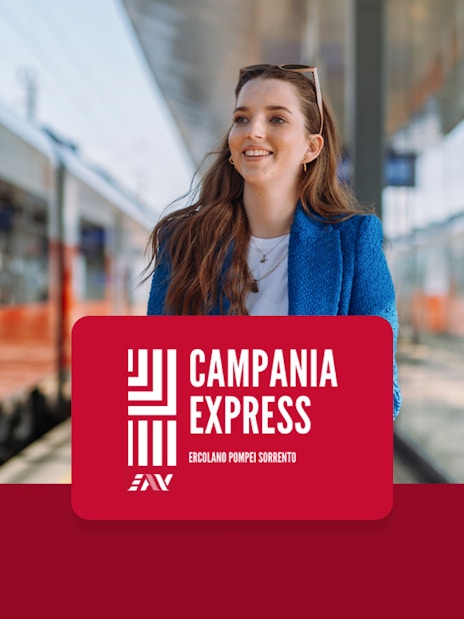Train platform at Naples Porta Nolana with Campania Express sign.