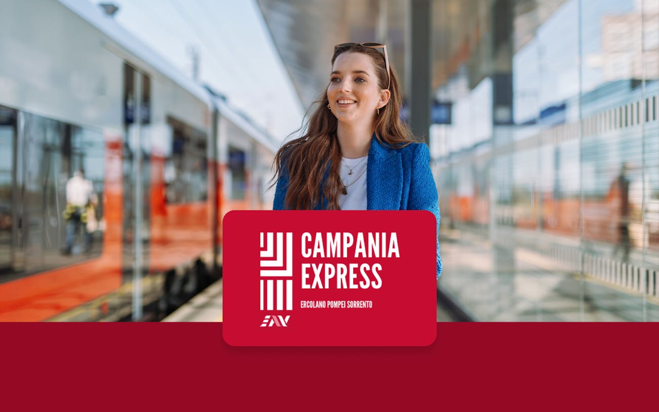 Train platform at Naples Porta Nolana with Campania Express sign.
