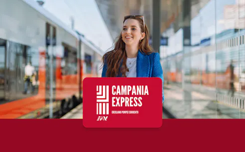 Train platform at Naples Porta Nolana with Campania Express sign.
