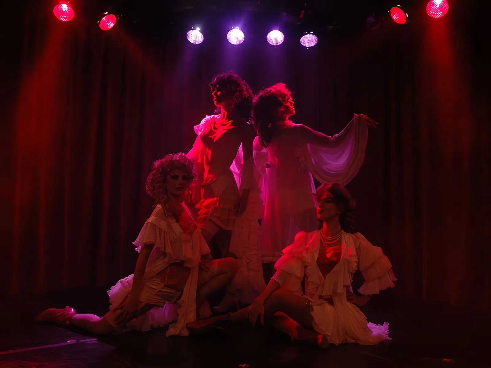 Performers in elegant costumes on stage at Rojo Tango Show, Buenos Aires.