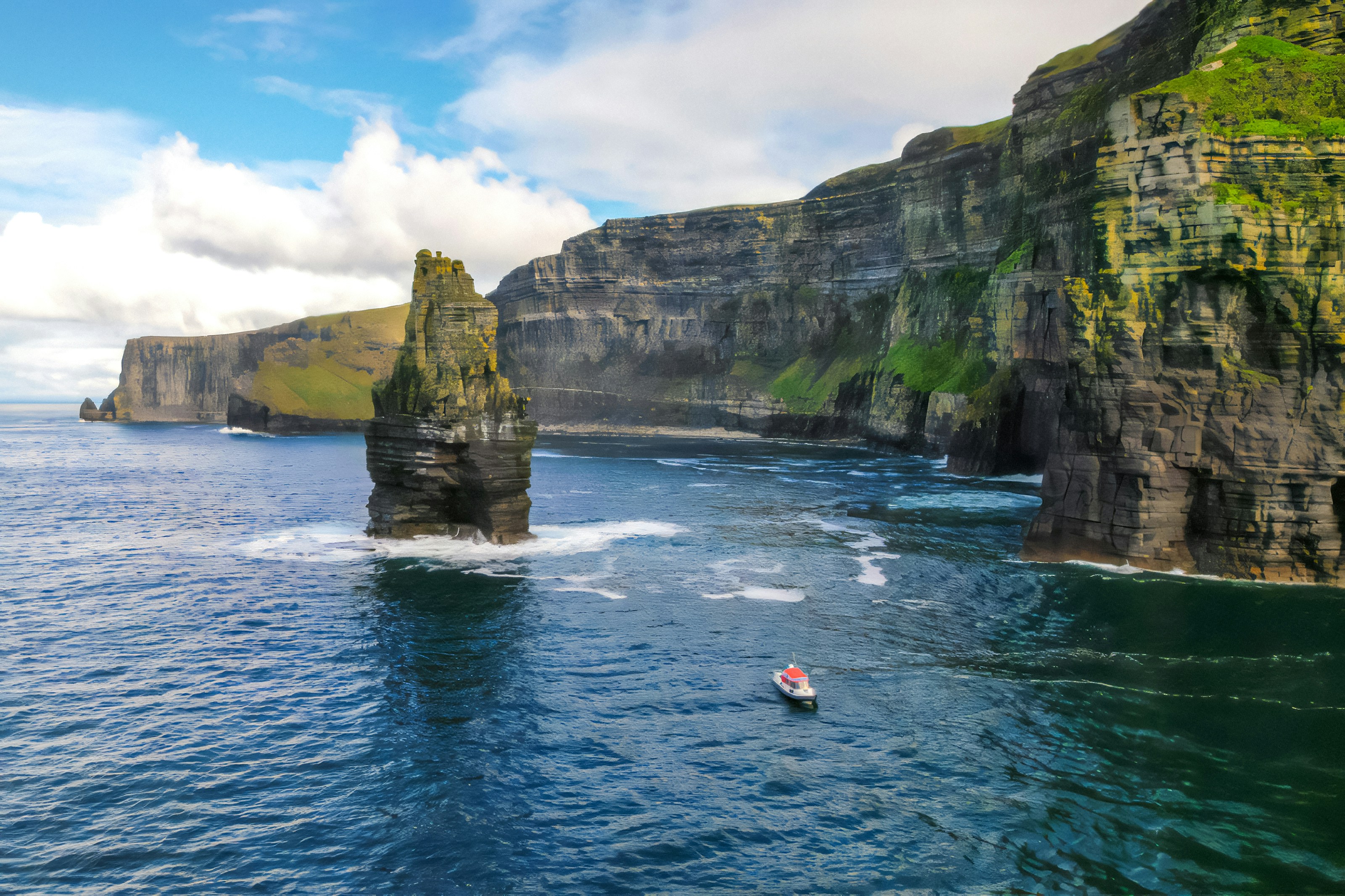 Aerial view of a boat near the Cliffs of Moher, Ireland.