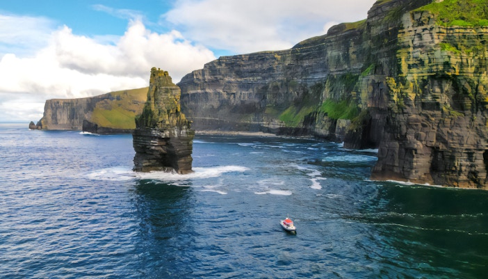 Aerial view of a boat near the Cliffs of Moher, Ireland.