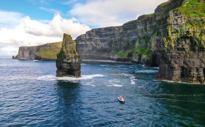 Aerial view of a boat near the Cliffs of Moher, Ireland.