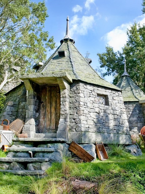 Hagrid's stone hut with pumpkins at Universal Studios Orlando Harry Potter attraction.