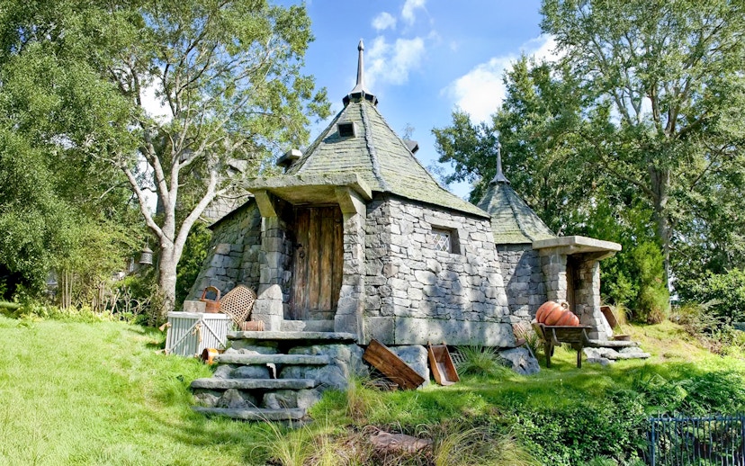 Hagrid's stone hut with pumpkins at Universal Studios Orlando Harry Potter attraction.