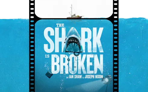 The Shark is Broken" poster with a shark and a boat above.