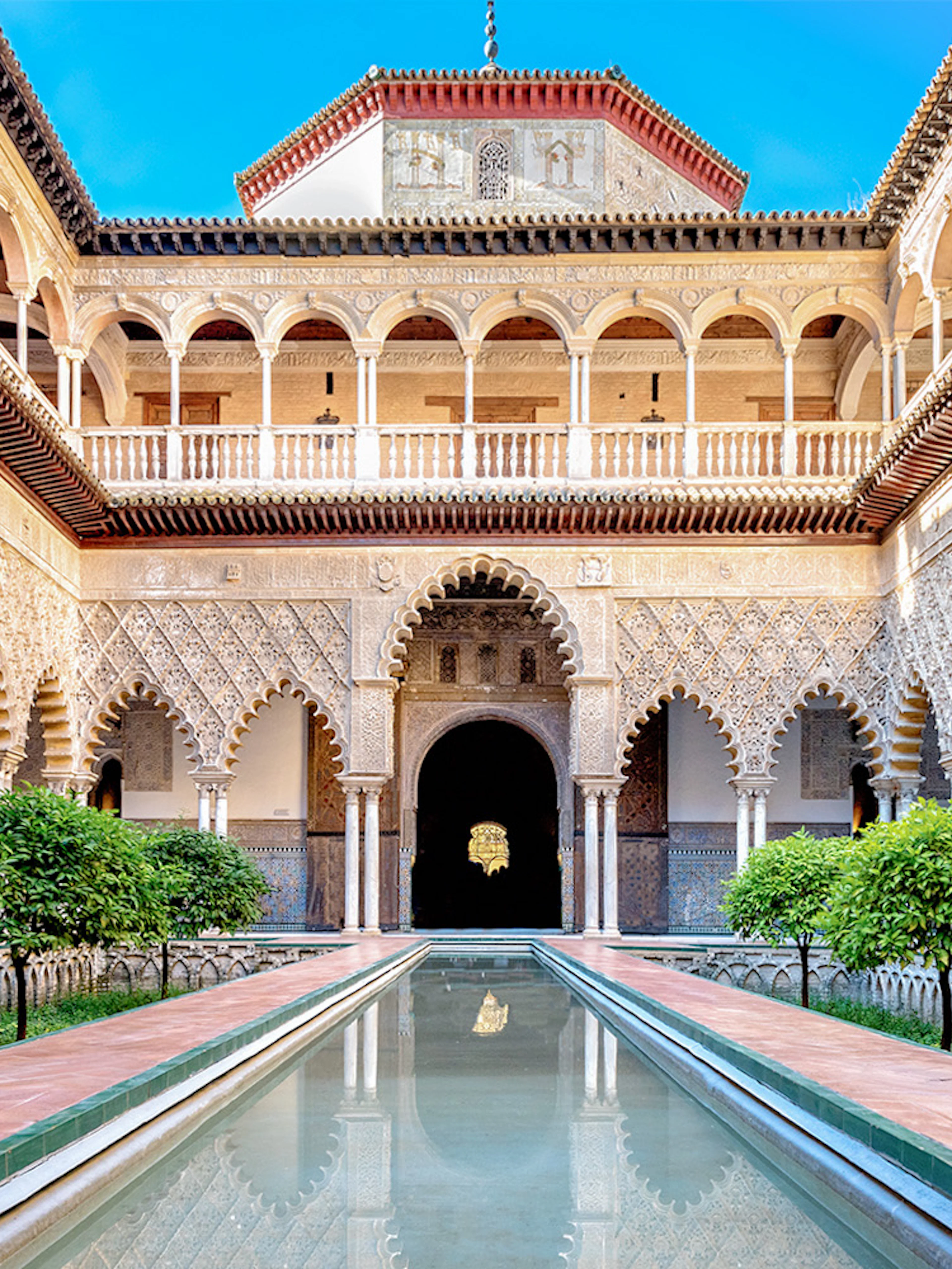 Patio de las Doncellas courtyard with reflecting pool, Real Alcazar, Seville.