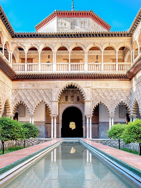 Patio de las Doncellas courtyard with reflecting pool, Real Alcazar, Seville.
