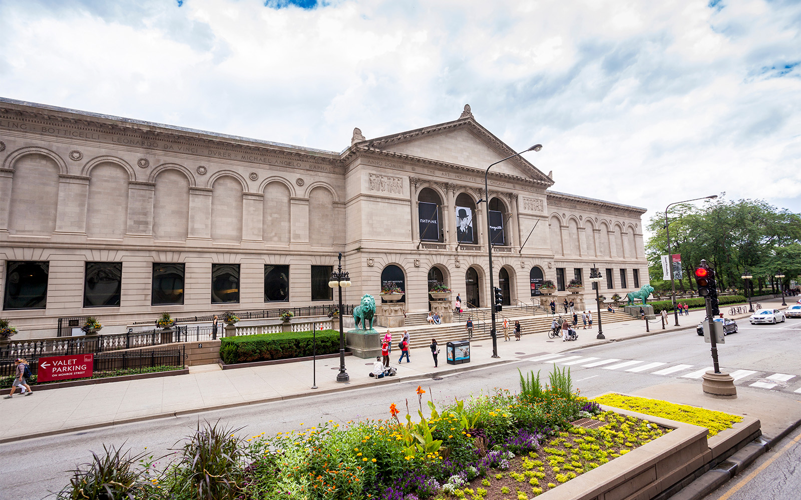 Art Institute of Chicago exterior with visitors and street view.