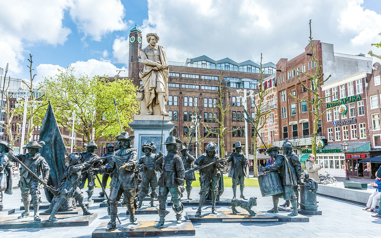 Rembrandt statue with bronze figures in Amsterdam, Netherlands.
