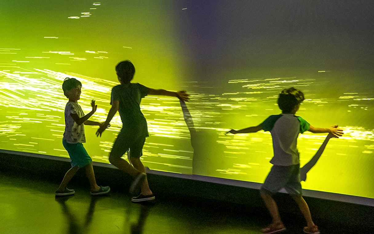 Children interacting with digital art at Istanbul Digital Experience Museum.