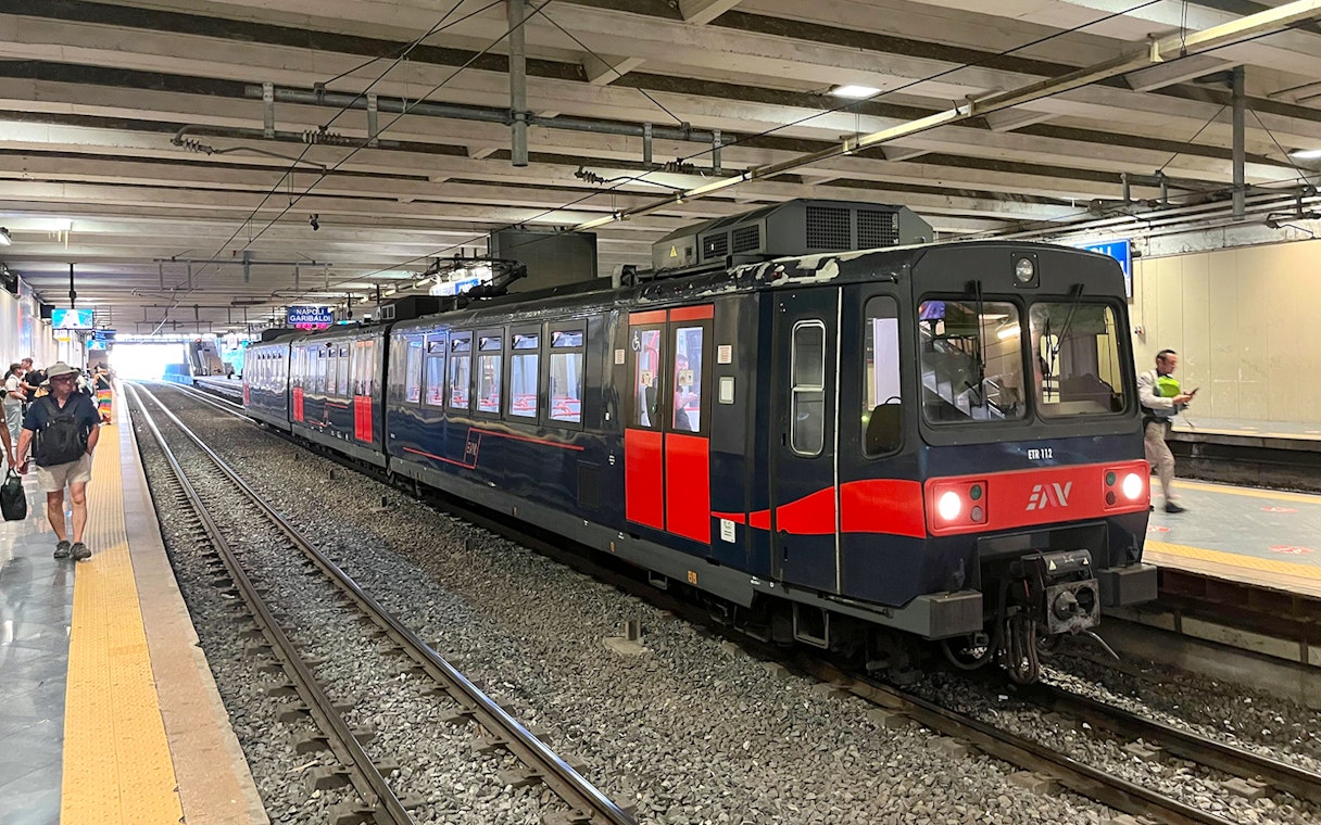 Campania Express train at Napoli Garibaldi station platform.