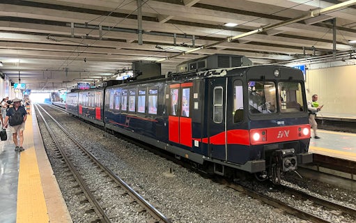 Campania Express train at Napoli Garibaldi station platform.