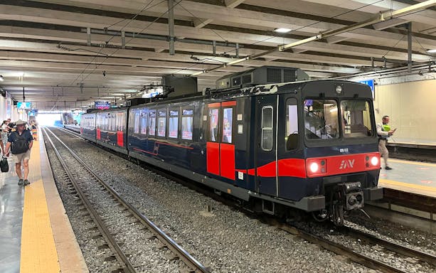 Campania Express train at Napoli Garibaldi station platform.