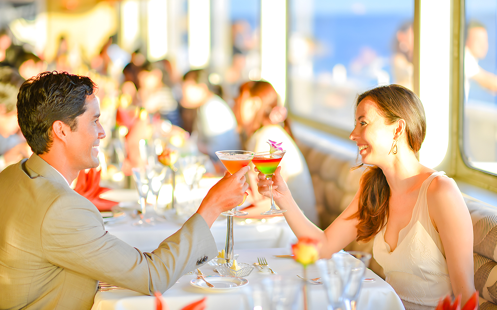Couple toasting cocktails on Nova Five Star 2 cruise dining experience.