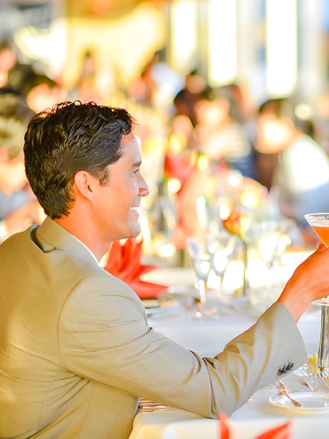 Couple toasting cocktails on Nova Five Star 2 cruise dining experience.
