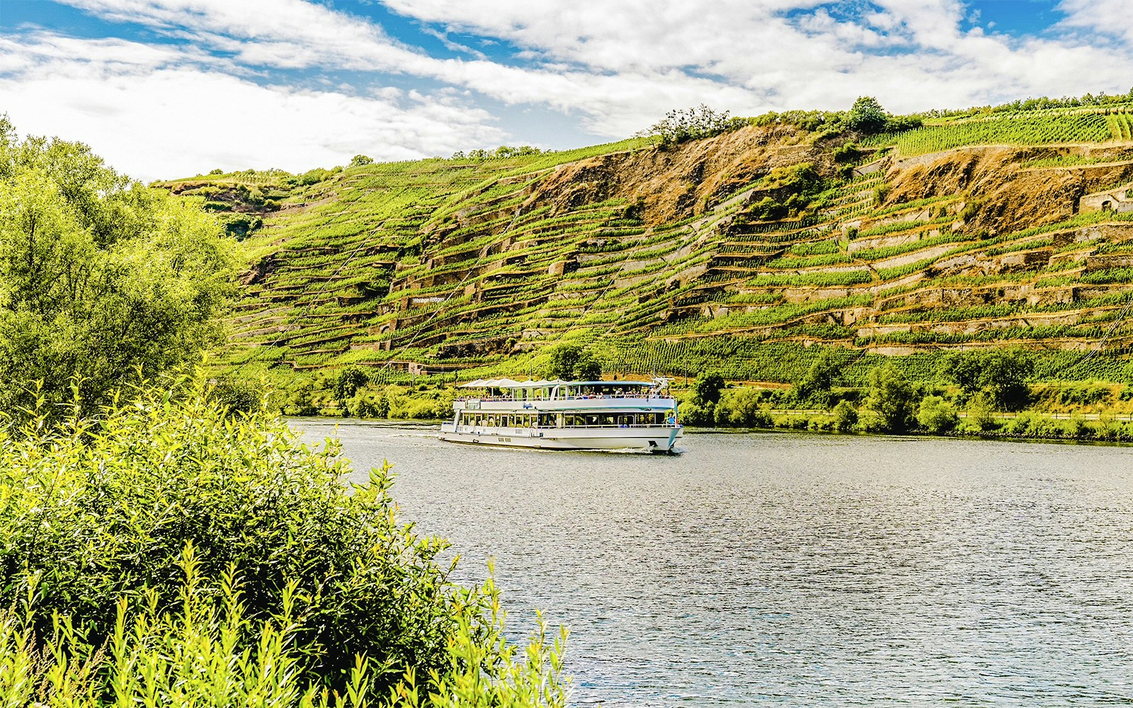 Koblenz sightseeing cruise on the Rhine River with views of Ehrenbreitstein Fortress.