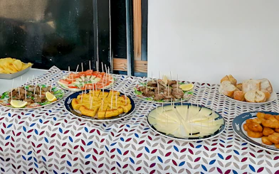 Tapas selection on a table for lunch during a whale watching luxury boat experience.