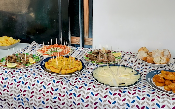 Tapas selection on a table for lunch during a whale watching luxury boat experience.