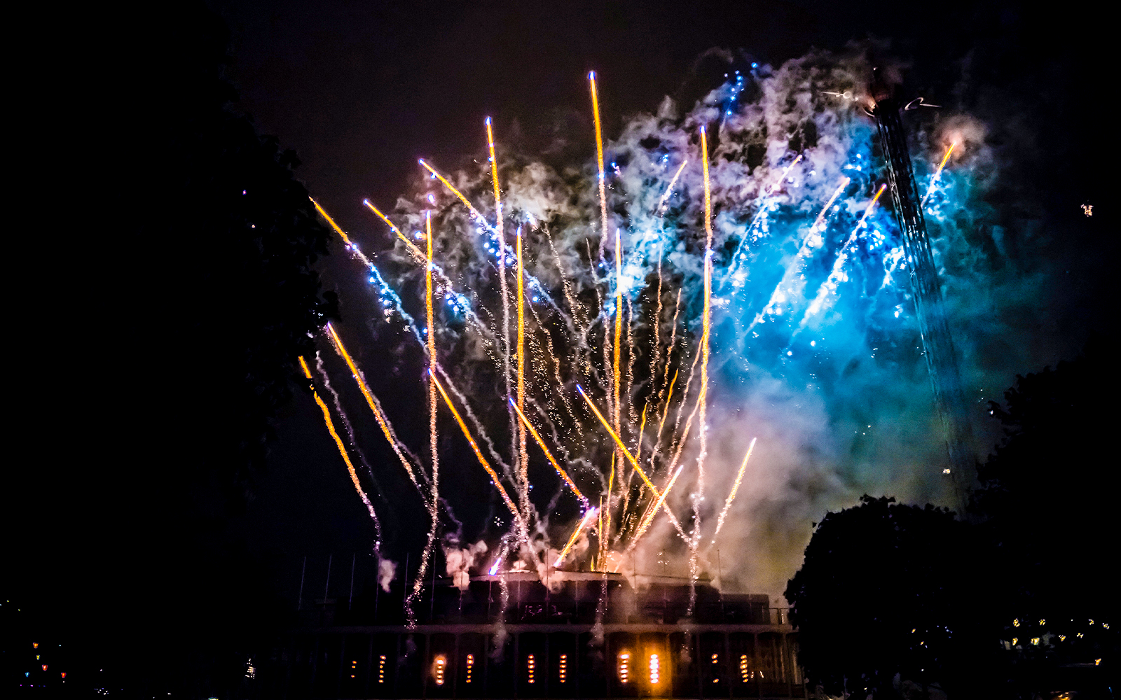Fireworks display over Tivoli Gardens in Copenhagen at night.