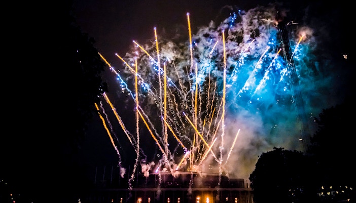 Fireworks display over Tivoli Gardens in Copenhagen at night.