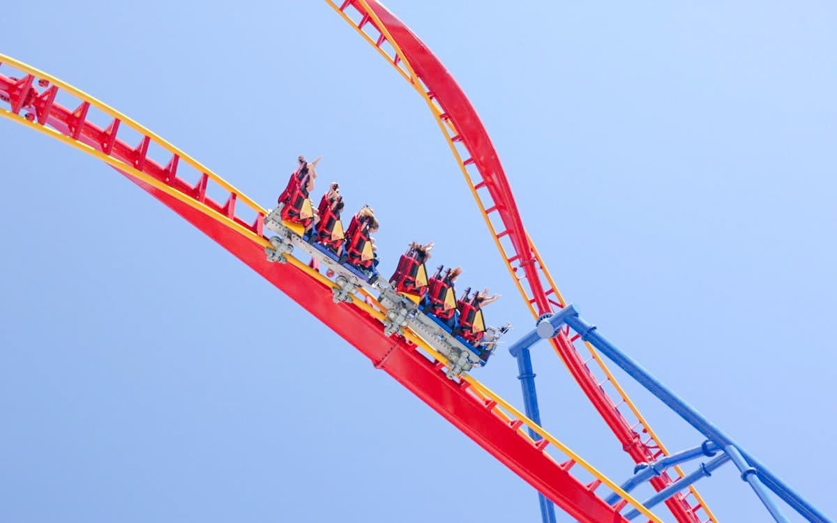 Roller coaster riders on SUPERMAN™ Ultimate Flight at Six Flags Discovery Kingdom.