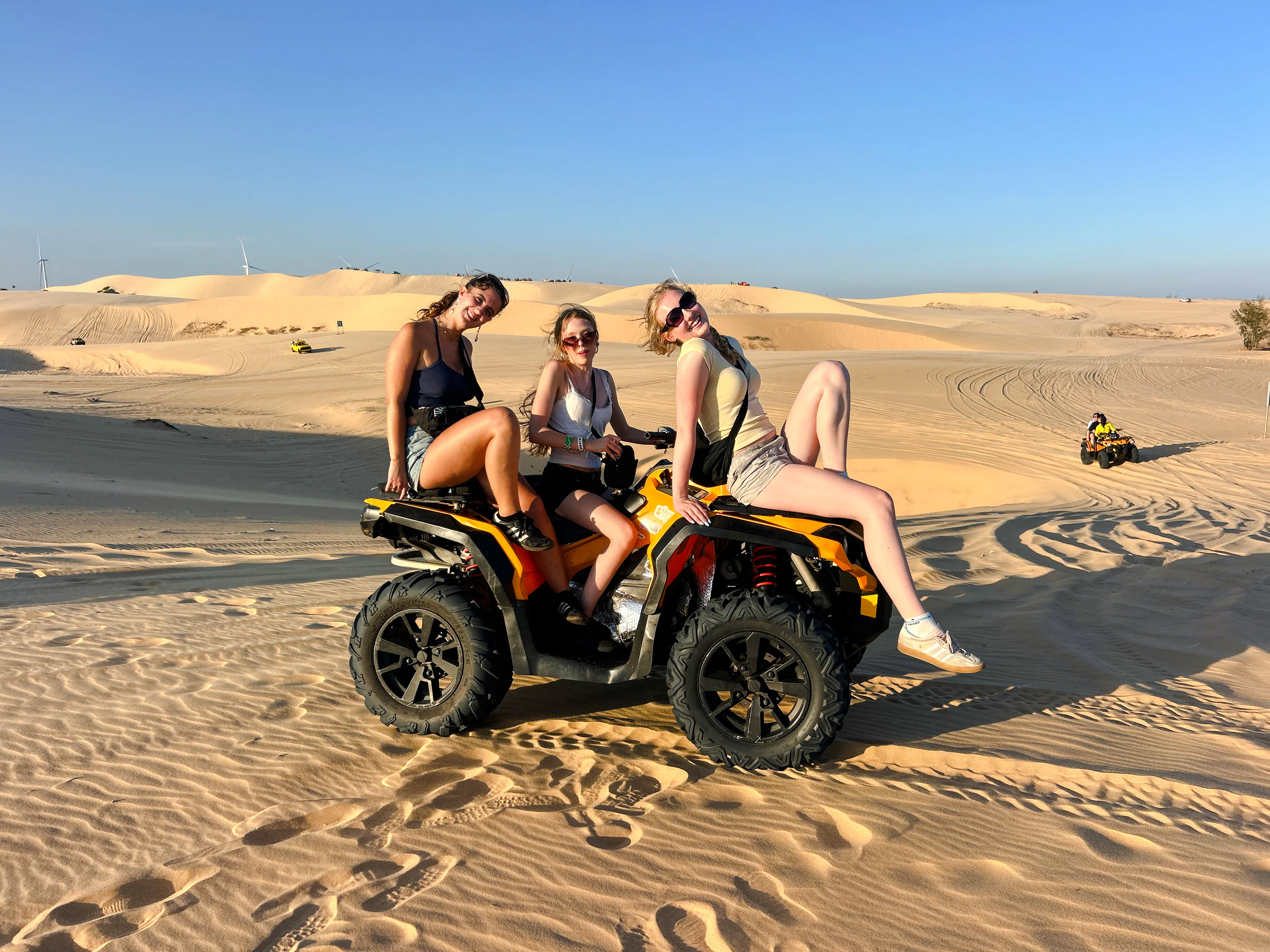 ATV riders on sand dunes during Mui Ne Jeep Tour, Ho Chi Minh City.