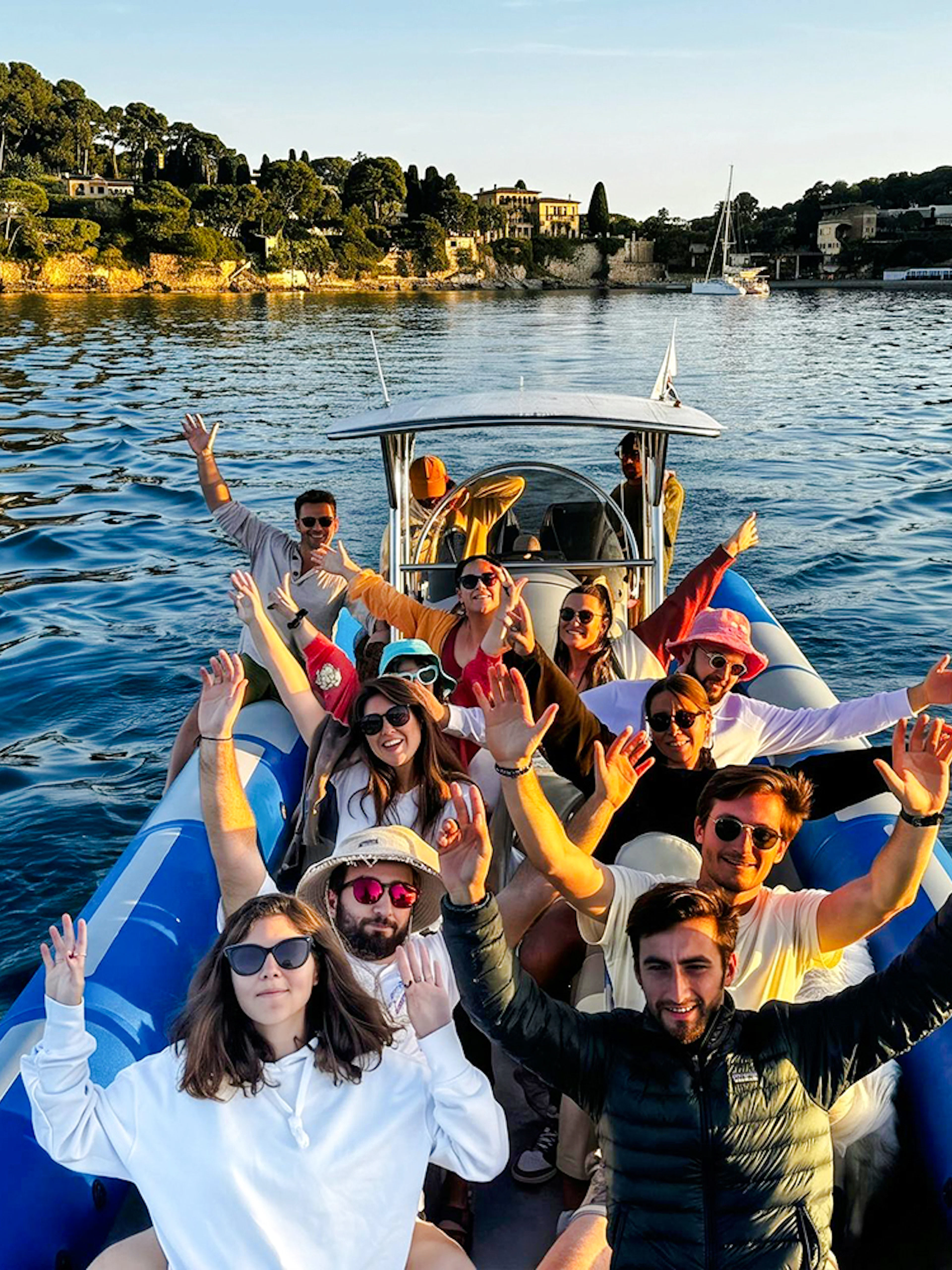 Group enjoying a boat tour to Villefranche and Mala Cove, with scenic coastal views.