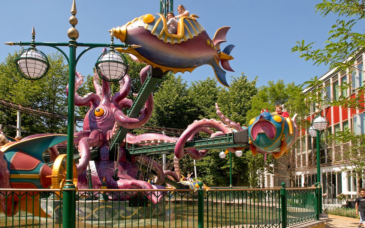 Tivoli Gardens ride with colorful fish-shaped cars and octopus structure.