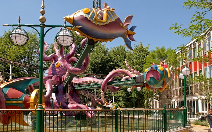 Tivoli Gardens ride with colorful fish-shaped cars and octopus structure.