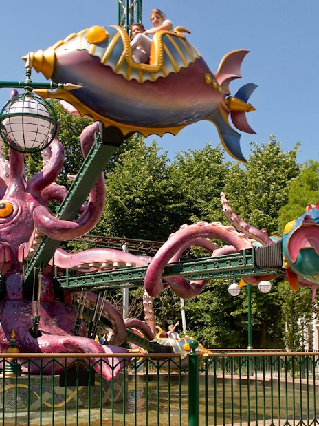 Tivoli Gardens ride with colorful fish-shaped cars and octopus structure.