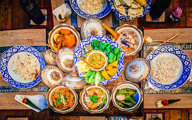 Traditional Thai meal with rice and various dishes in Mallika City, 1905 A.D.
