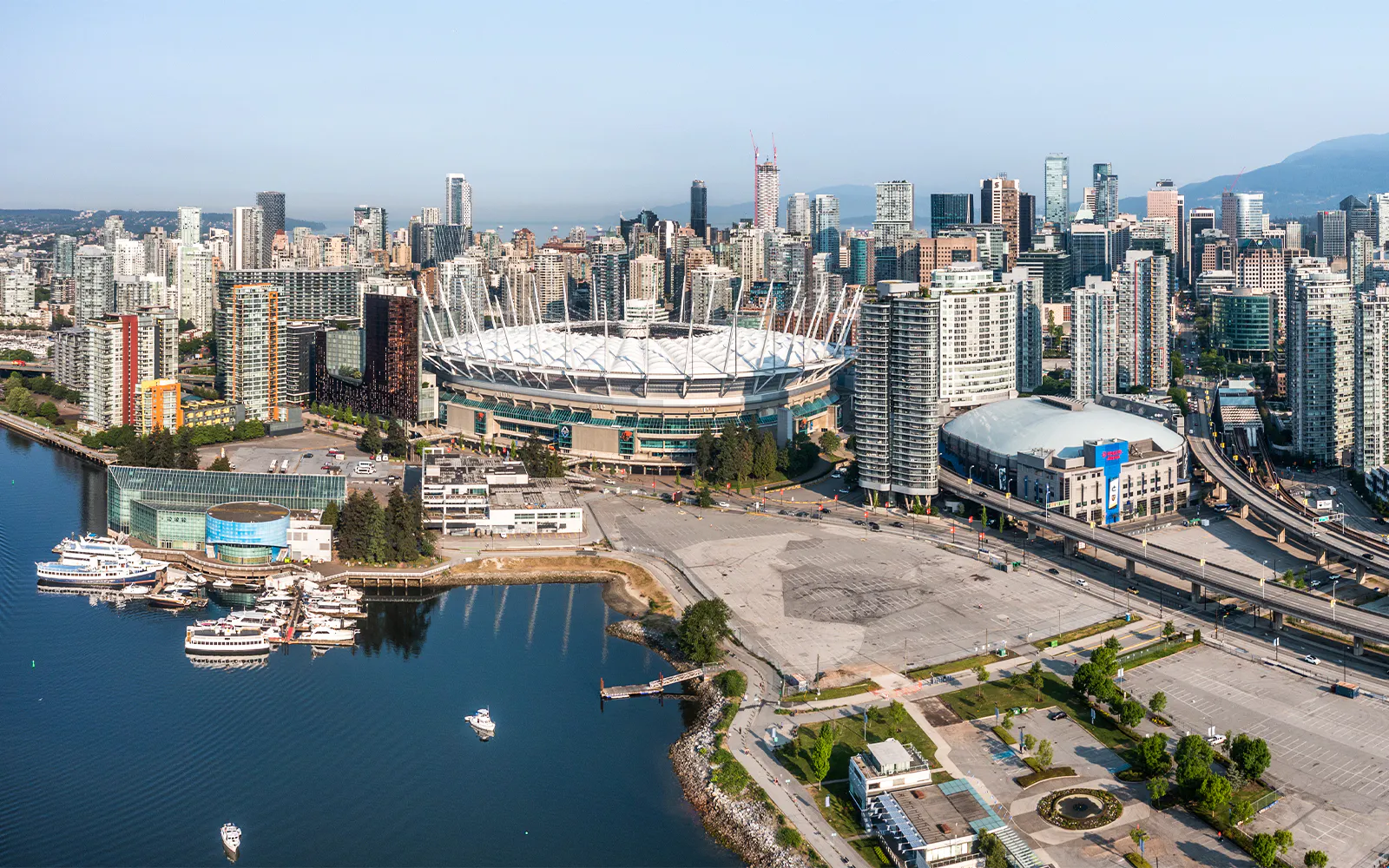 Vancouver skyline with BC Place Stadium during scenic seaplane tour.