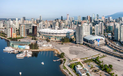 Vancouver skyline with BC Place Stadium during scenic seaplane tour.