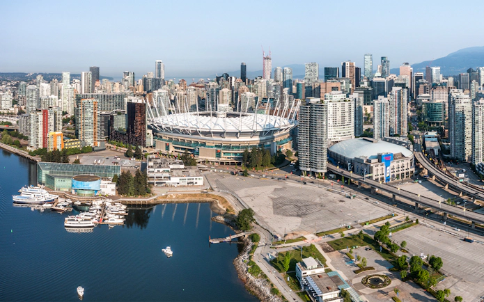 Vancouver skyline with BC Place Stadium during scenic seaplane tour.