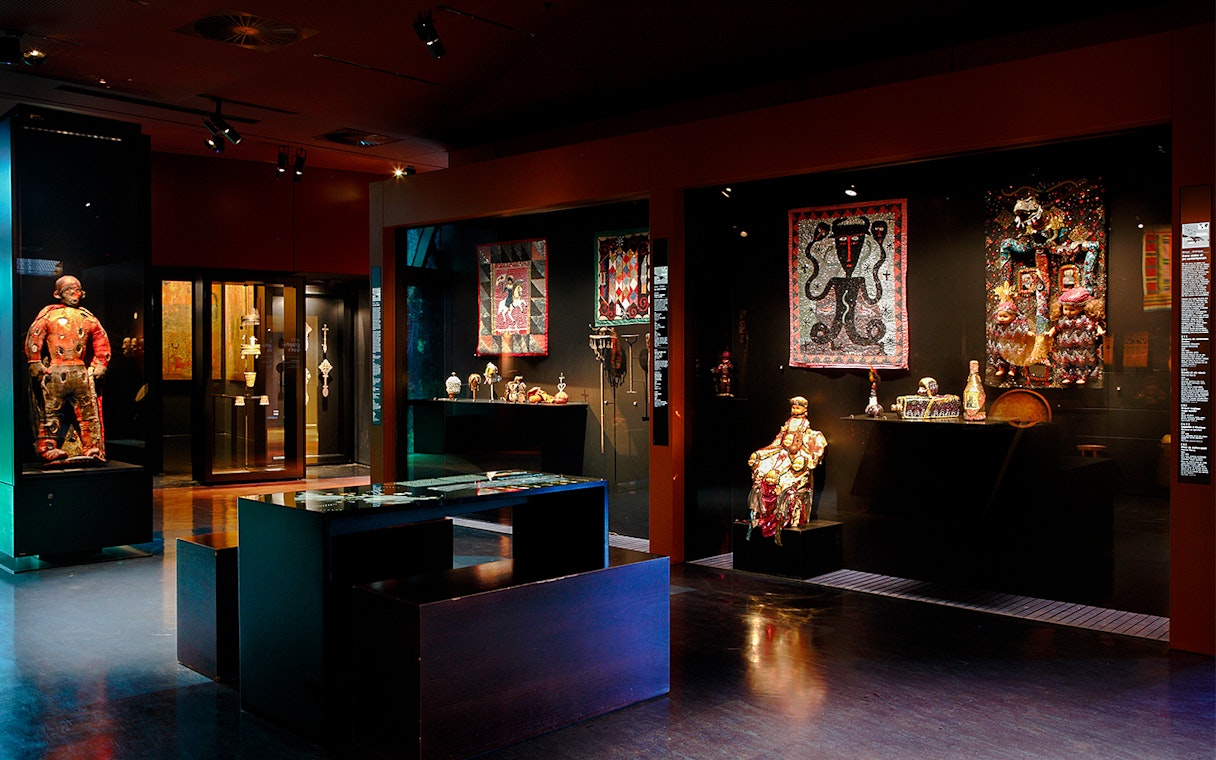 Quai Branly Museum interior exhibit with cultural artifacts, Paris.