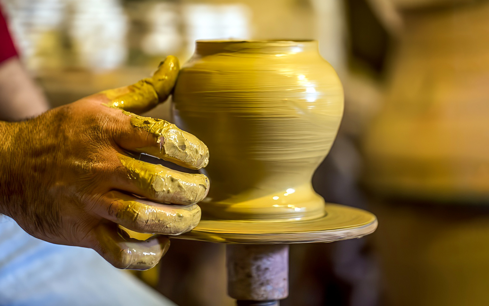 Pottery being shaped on a wheel during Cappadocia workshop experience.