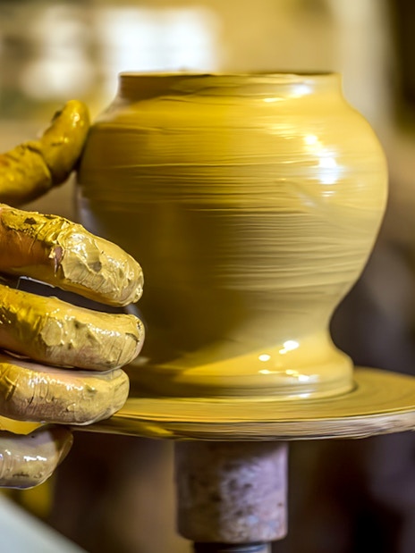 Pottery being shaped on a wheel during Cappadocia workshop experience.