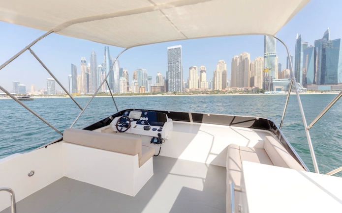 Viktoriia Luxury Yacht deck with Dubai Marina skyline in the background.