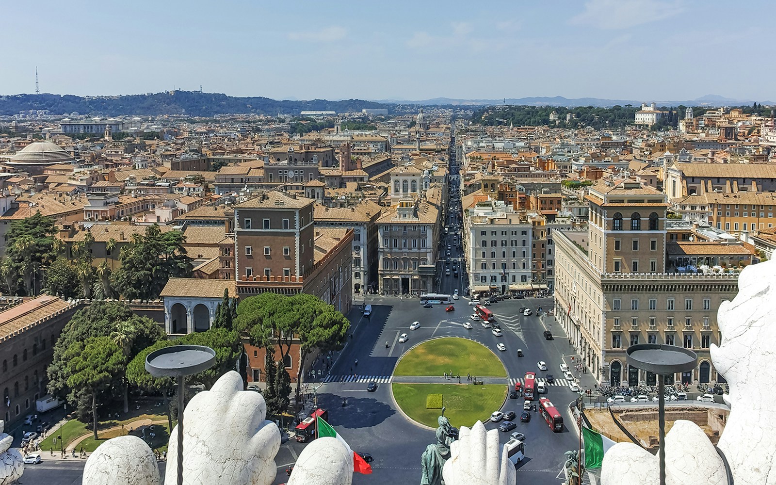 View from the top of the Altar of the Fatherland in Rome, showcasing cityscape and historic landmarks.