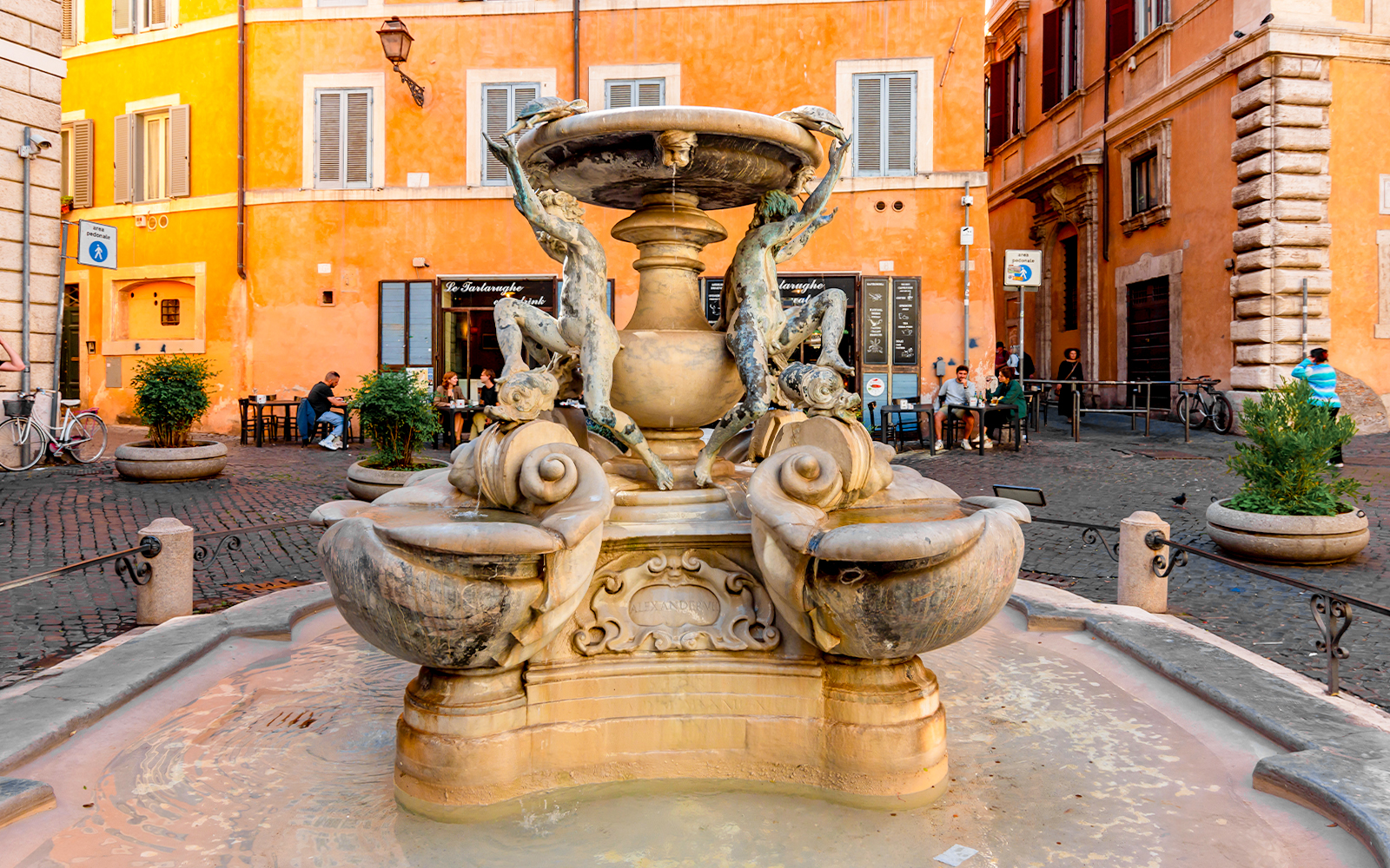 Turtle Fountain by Bernini in Rome's Piazza Mattei, featuring sculpted turtles and intricate stonework.