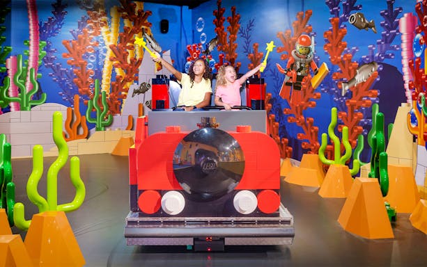 Children enjoying a LEGO submarine ride at LEGO Discovery Centre Hamburg.