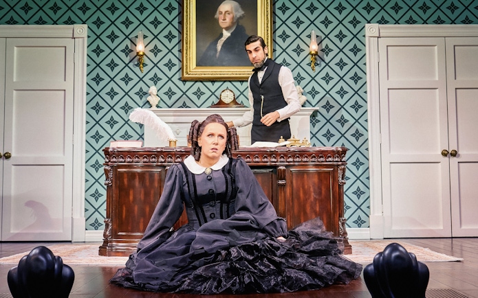 Stage scene from Oh, Mary Westend show with actors in period costumes.