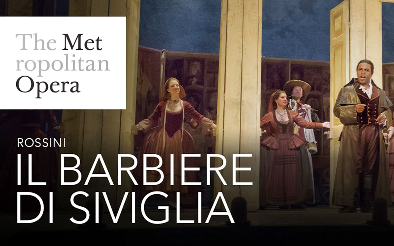 Performers on stage at the Met Opera's Il Barbiere Di Siviglia.
