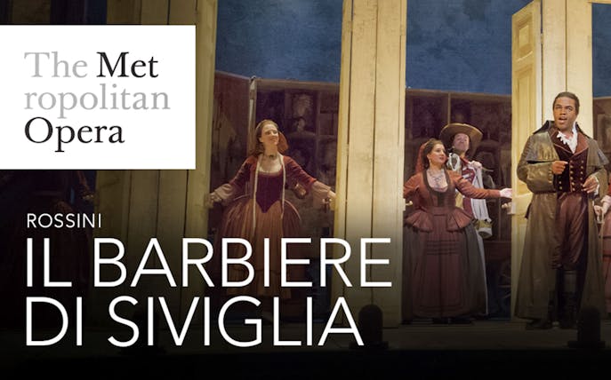 Performers on stage at the Met Opera's Il Barbiere Di Siviglia.