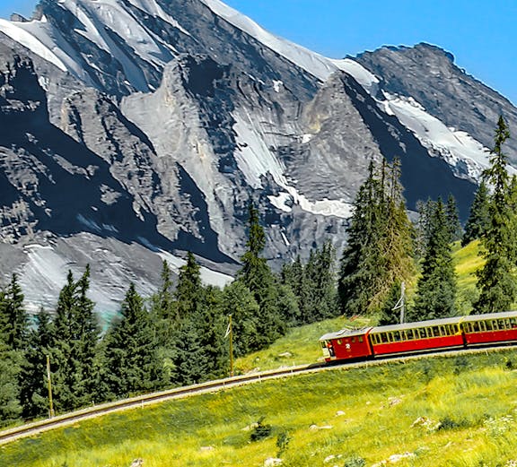 Schynige Platte Railway train on a mountain track in Bernese Highlands, Switzerland.