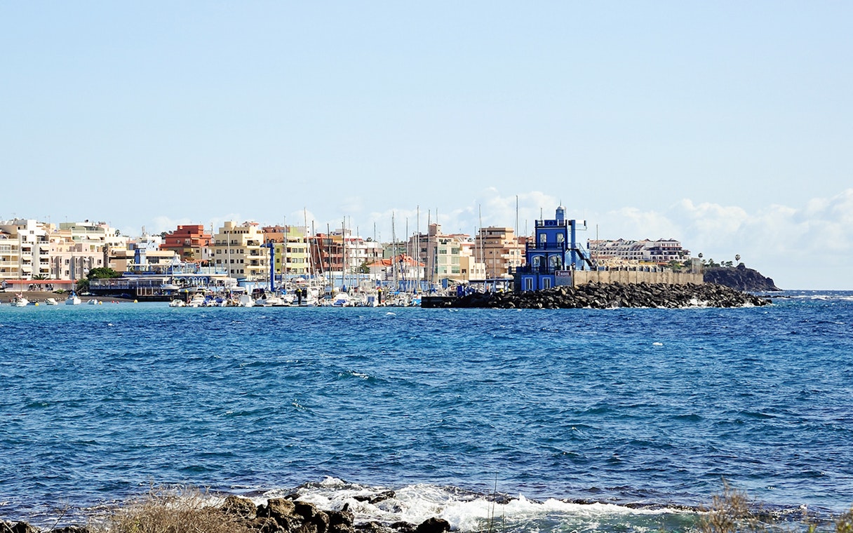 Marina del Sur with boats and colorful buildings, Las Galletas, Tenerife, Spain.